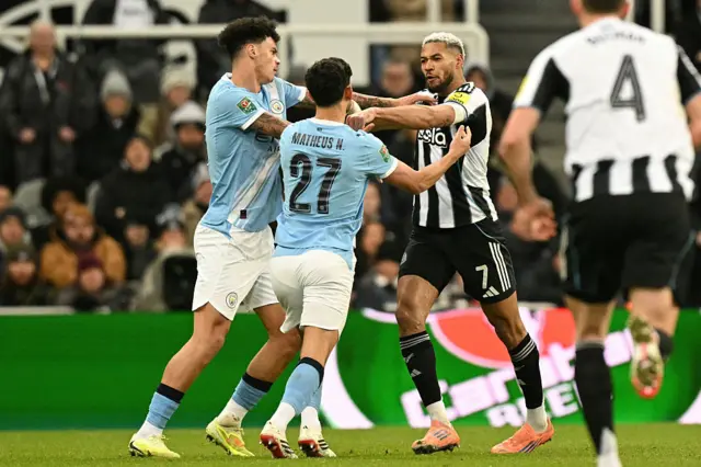 Newcastle United's Brazilian midfielder #07 Joelinton (R) clashes with Manchester City's Portuguese midfielder #27 Matheus Nunes