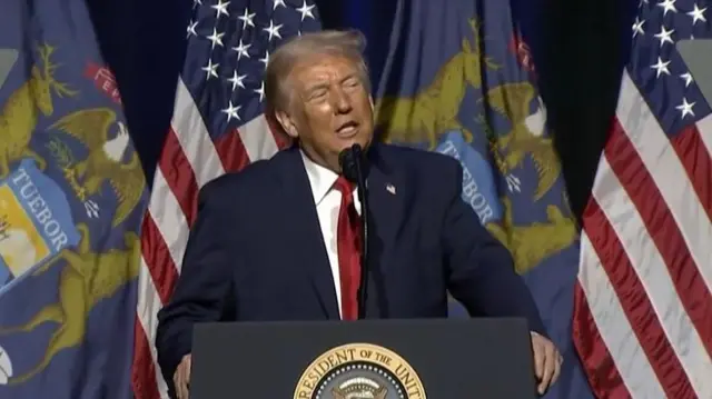 Donald Trump behind a podium