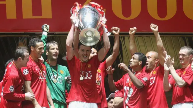 Michael Carrick lifts the Champions League trophy after helping Manchester United beat Chelsea in the final in Moscow in 2008. He is flanked on this image by Wayne Rooney and Darren Fletcher
