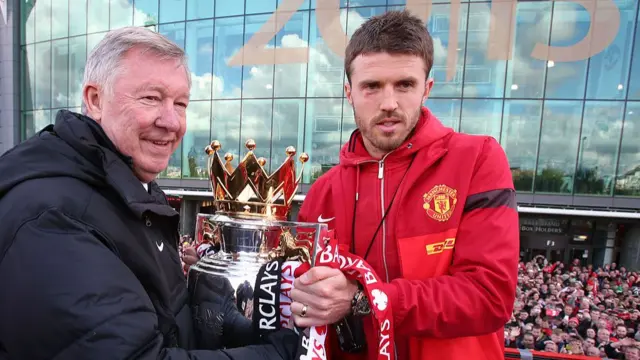 Manager Sir Alex Ferguson of Manchester United and Michael Carrick pose with the Premier League trophy