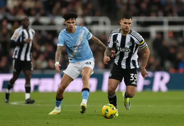 Manchester City's Nico OReilly in action with Newcastle United's Bruno Guimaraes
