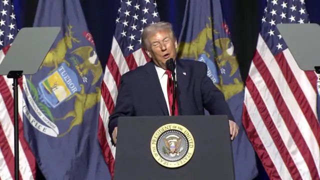 Trump on stage with american flags