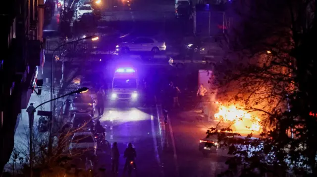 Cars burn in a street during a protest over the collapse of the currency's value, in Tehran, Iran, January 8,