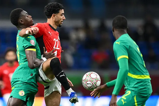 Marmoush holds off two defenders