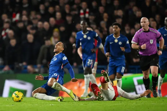 Arsenal's Mikel Merino fouls Chelsea's Joao Pedro before being shown a yellow card
