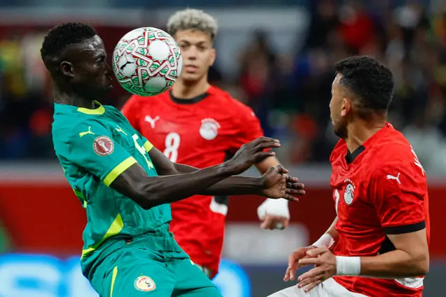 Diatta controls the ball with many defenders in close quarters