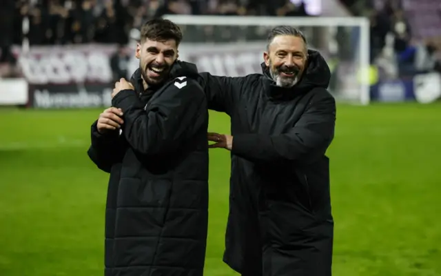 Claudio Braga and Derek McInnes celebrate after full-time