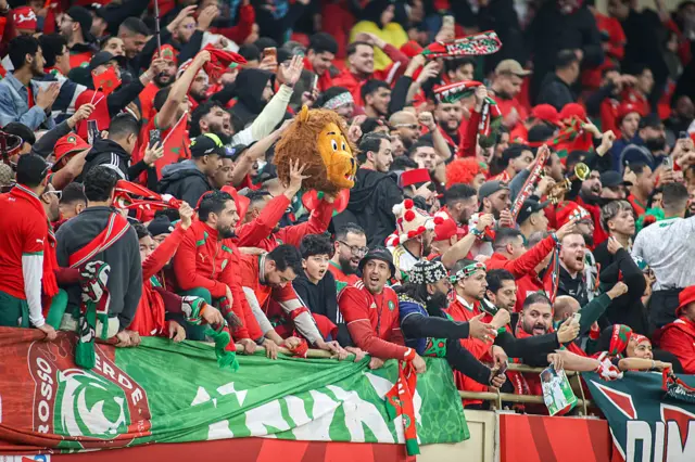 Morocco fans stand in support