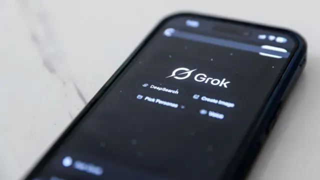 Phone screen displaying Grok tab open