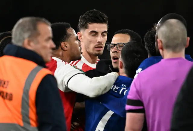 Arsenal's Kai Havertz and Gabriel Magalhaes clash with Chelsea players after the match as Chelsea manager Liam Rosenior reacts