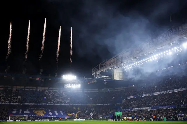 A general view inside the stadium as pyrotechnics display takes place