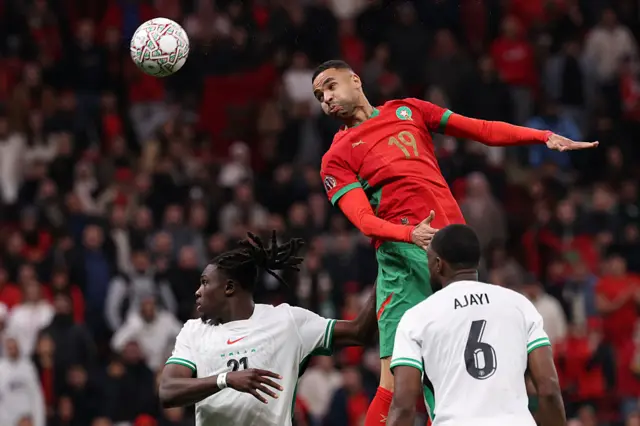 Youssef En-Nesyri jumps to head the ball