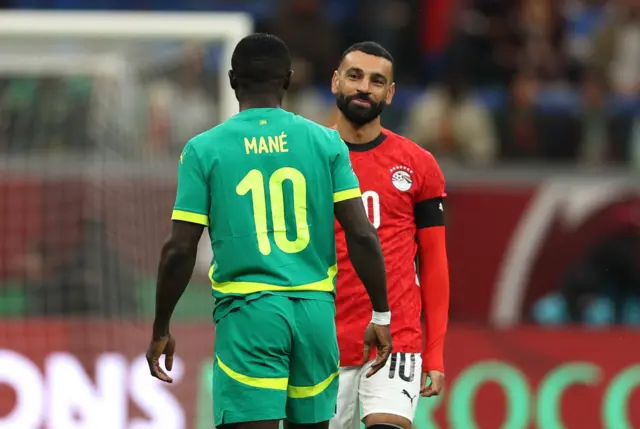 Egypt's Mohamed Salah reacts with Senegal's Sadio Mane