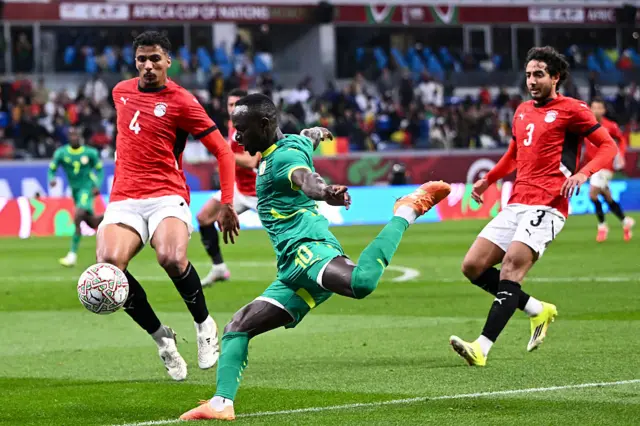 Mane looks to run past his marker
