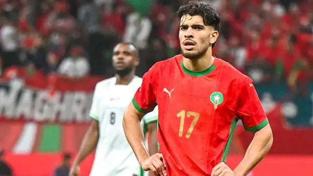 Ezzalzuli stands with his hands on his hips