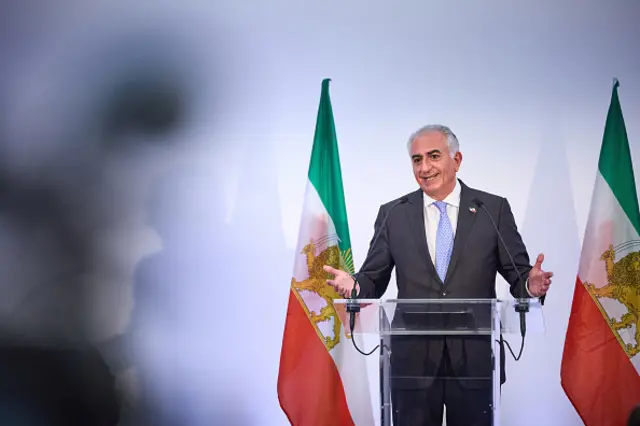 Reza Pahlavi, the eldest son of the last Shah of Iran, gestures as he addresses the media during a press conference on June 23, 2025 in Paris, France