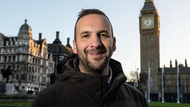 Zack Polanski in front of Big Ben
