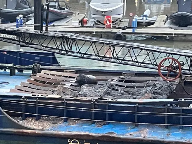 A dredger boat with a large object on the back