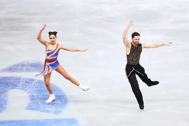 Lilah Fear and Lewis Gibson of Great Britain perform in the Ice Dance