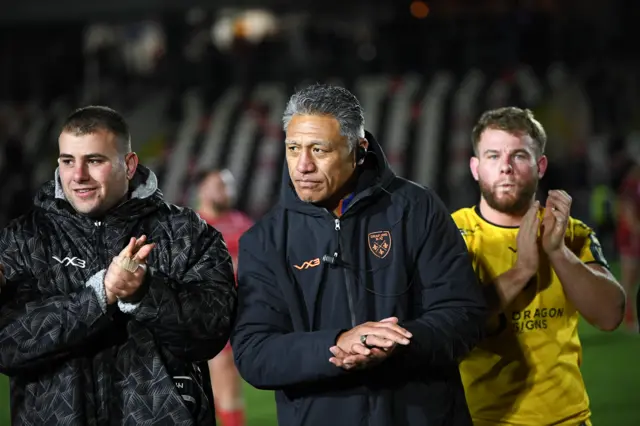 Filo Tiatia in a Dragons huddle