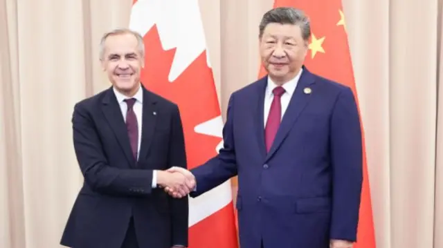Mark Carney and Xi Jinping shaking hands