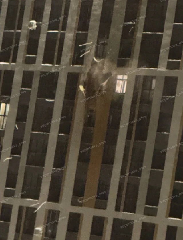 A zoomed in image of a multi-story building in the Russian city of Ryazan, which was damaged overnight in a reported drone attack.