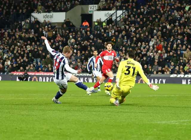 Aune Heggebo of West Bromwich Albion shot is saved by Sol Brynn of Middlesbrough