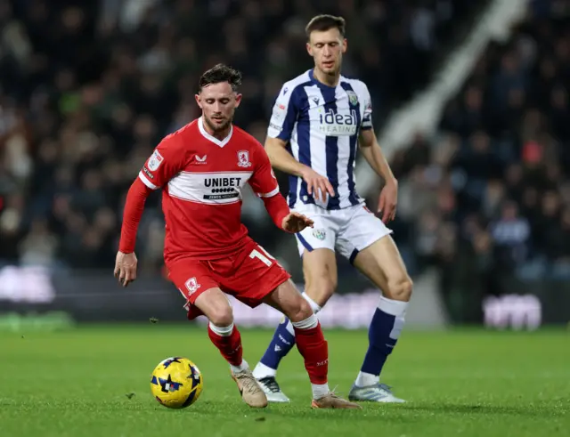 Alan Browne of Middlesbrough runs with the ball whilst under pressure from Krystian Bielik of West Bromwich Albion