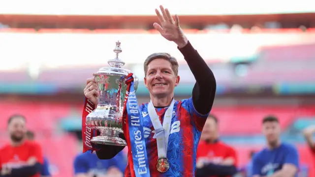 Oliver Glasner celebrates with FA Cup trophy