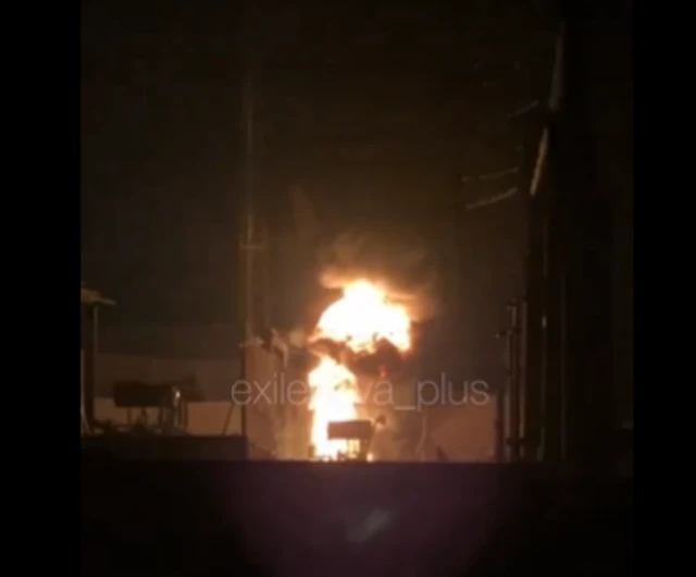 Fire seen rising from building at night