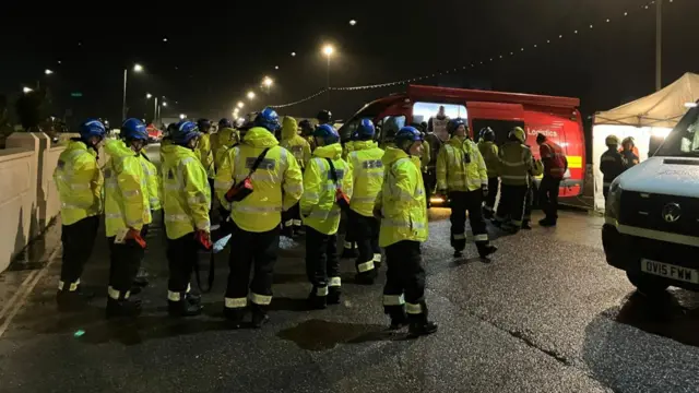 A group of people wearing high vis jackets and other safety gear