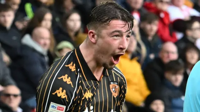 Charlie Hughes celebrates scoring