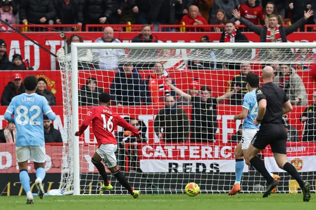 Manchester United's Ivorian forward #16 Amad Diallo scores from an offside position