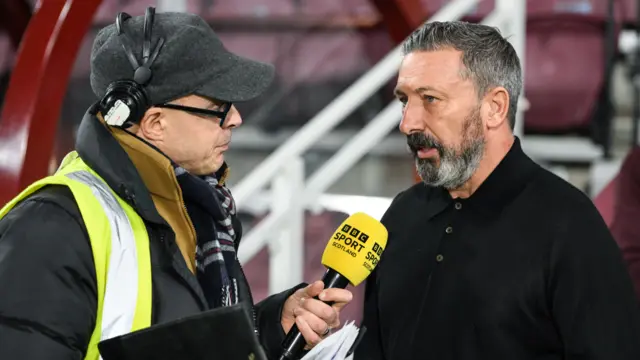Hearts manager Derek McInnes with BBC Scotland's Kheredine Idessane
