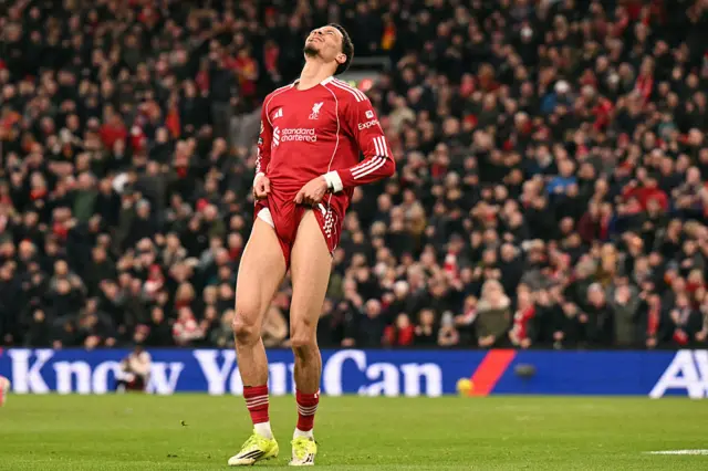 Liverpool's French striker #22 Hugo Ekitike reacts after missing a chance