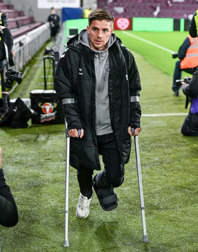 Cammy Devlin on crutches