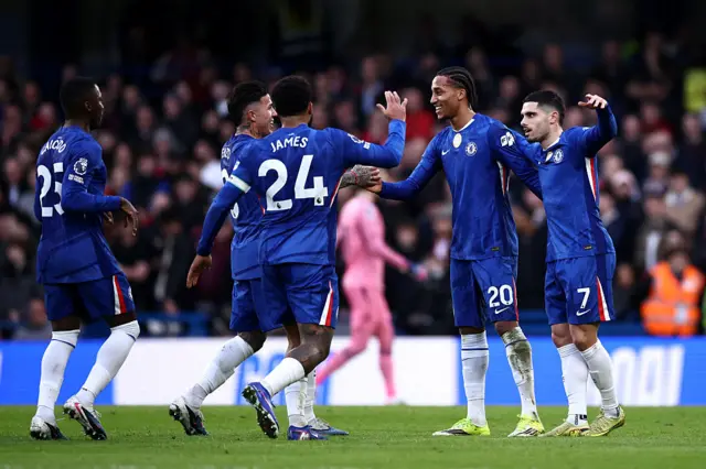 Chelsea's Brazilian striker #20 Joao Pedro (2R) celebrates scoring the team's first goal