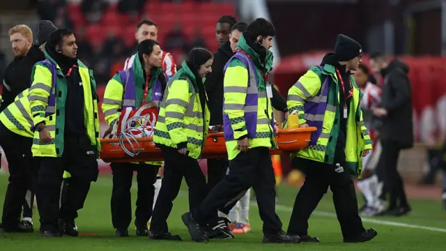 Divin Mubama stretchered off