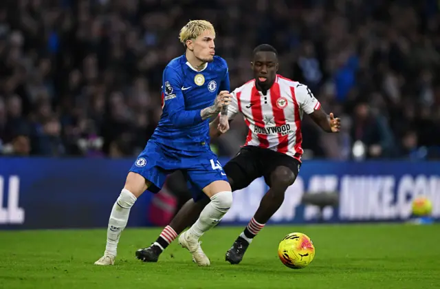 Alejandro Garnacho of Chelsea is put under pressure by Michael Kayode of Brentford