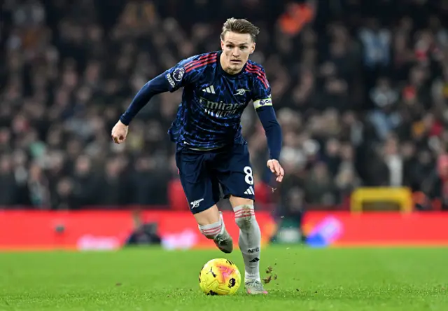 Martin Odegaard of Arsenal runs with the ball
