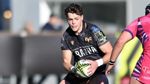 Jack Walsh running with the ball for Ospreys