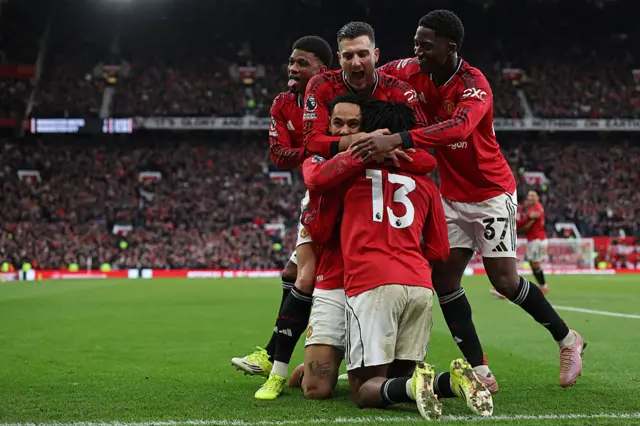 Manchester United's Danish defender #13 Patrick Dorgu celebrates with teammates