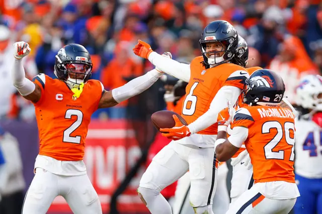 PJ Locke and Denver Broncos defence celebrate