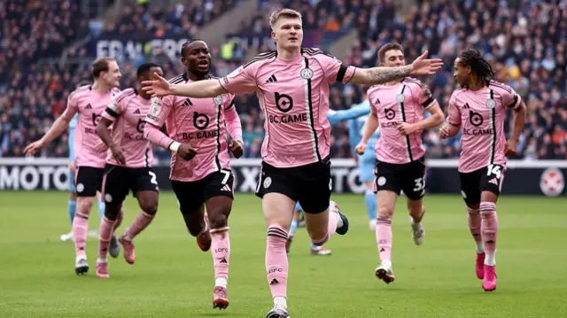 Leicester goalscorer with his arms spread wide runs away to celebrate his goal against Coventry