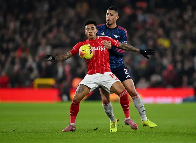 Igor Jesus of Nottingham Forest is put under pressure by William Saliba of Arsenal