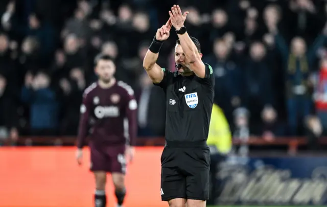 Nick Walsh signals for handball