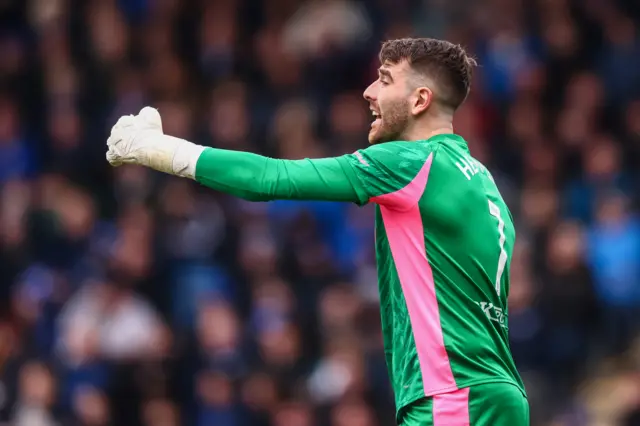 Chesterfield Goalkeeper Zach Hemming gives instruction to players
