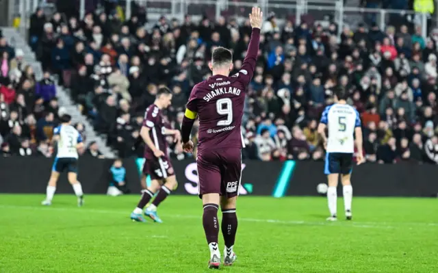 Lawrence Shankland gestures to the Hearts bench