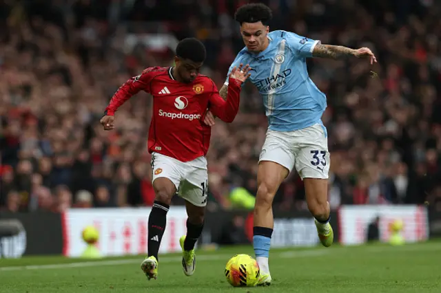 Amad Diallo (L) vies with Manchester City's English midfielder  Nico O'Reilly