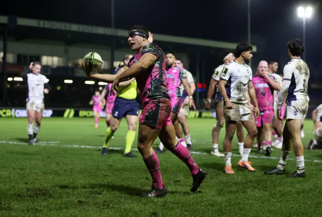 Lewis Lloyd celebrates his try